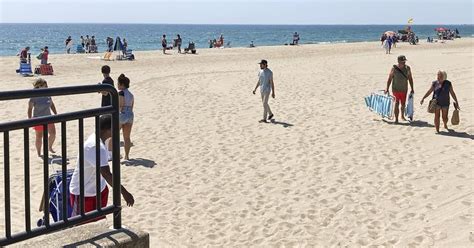 Beach closures because of contamination prevent sunbathers from taking a dip to beat the heat